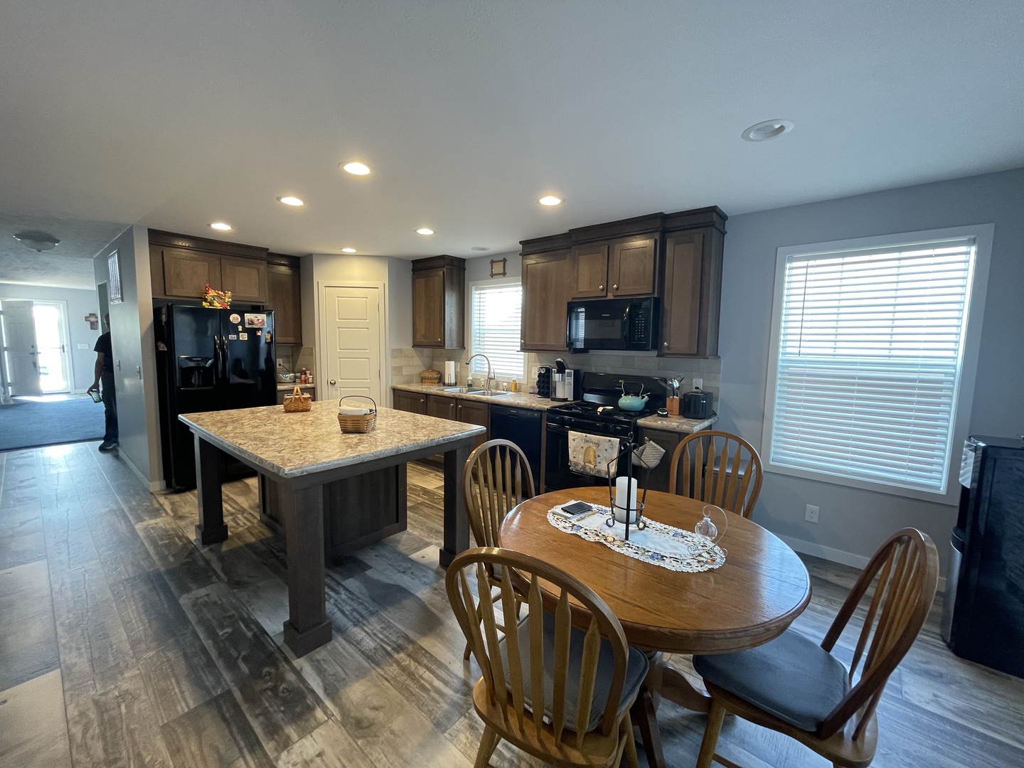 25715 Olympic Drive Monee, IL 60449 - Photo 14 of 19 a view of a a dining room with furniture window and wooden floor
