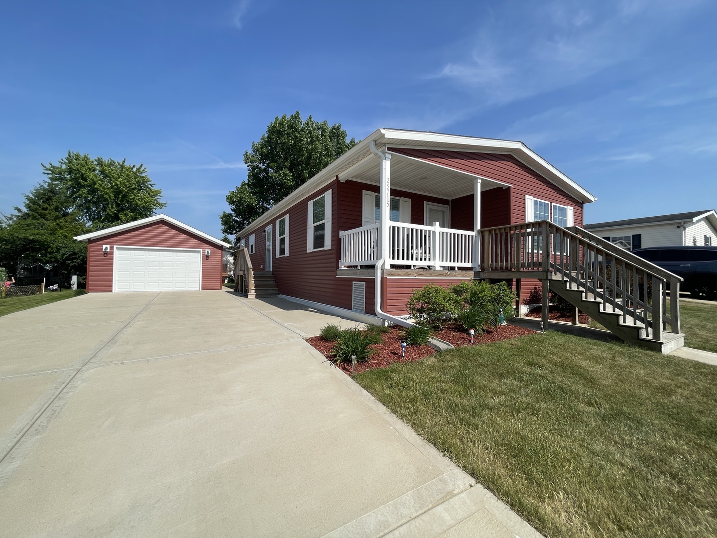 25715 Olympic Drive Monee, IL 60449 - Photo 18 of 19 a front view of a house with garden