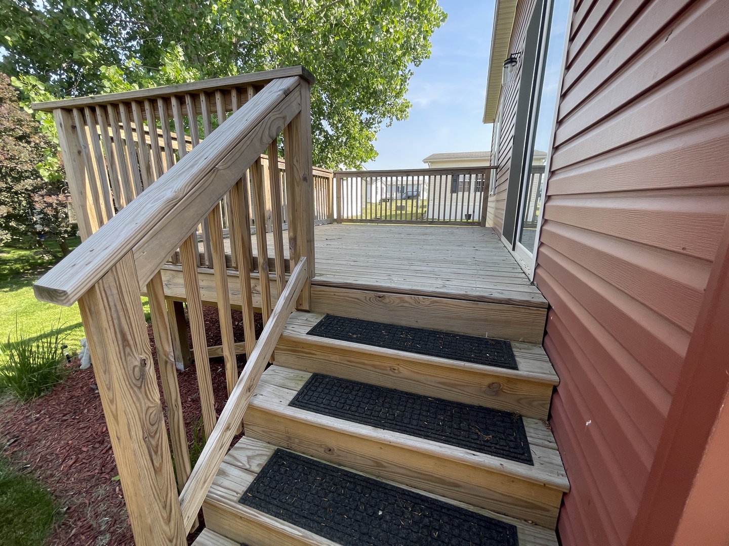 25715 Olympic Drive Monee, IL 60449 - Photo 3 of 19 a view of wooden staircase with railing and white walls