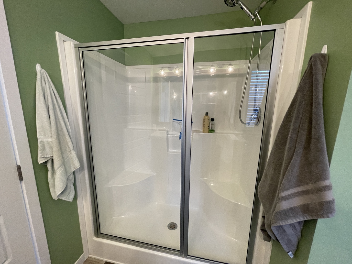 25715 Olympic Drive Monee, IL 60449 - Photo 7 of 19 a bathroom with a glass door shower and a mirror