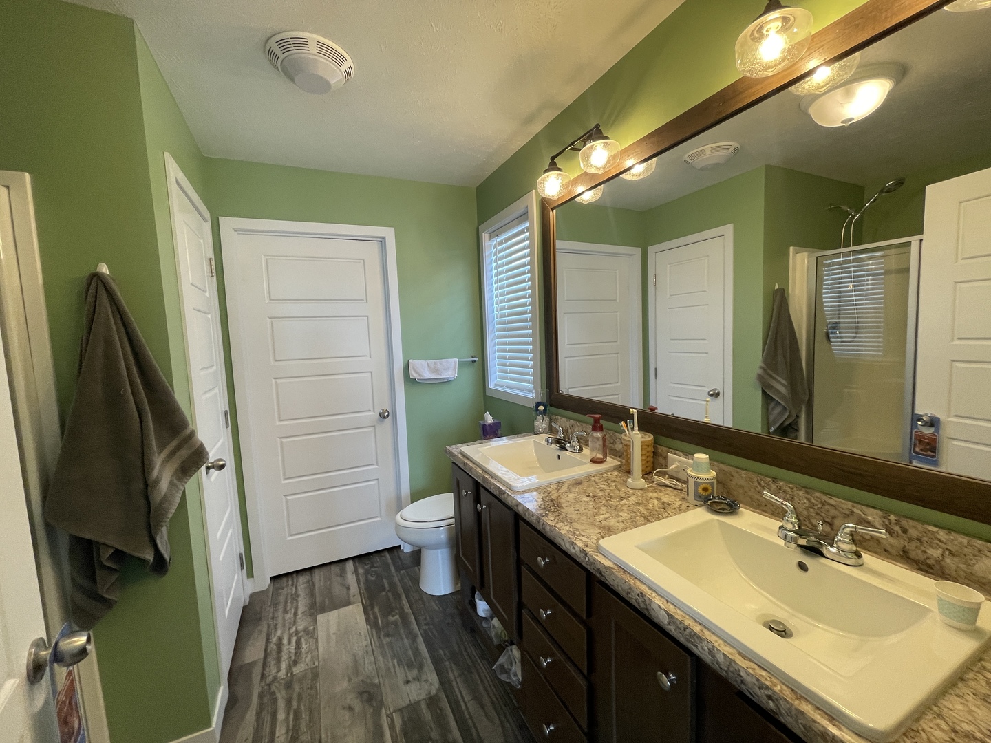 25715 Olympic Drive Monee, IL 60449 - Photo 8 of 19 a bathroom with a sink a toilet and a mirror