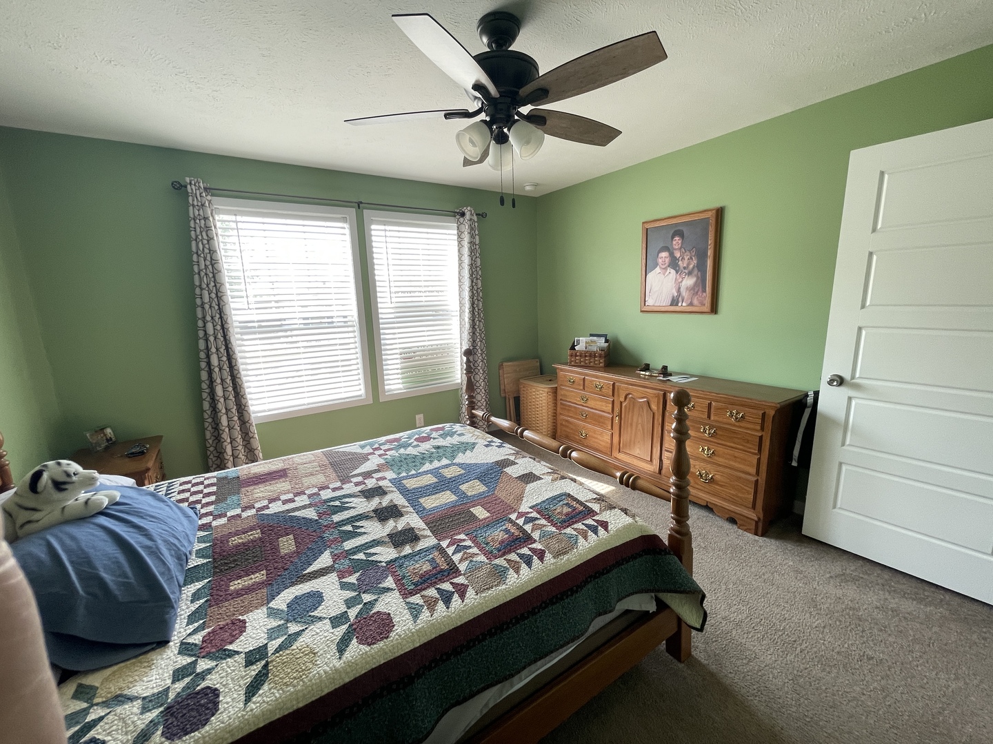 25715 Olympic Drive Monee, IL 60449 - Photo 9 of 19 a bedroom with a bed and a chandelier
