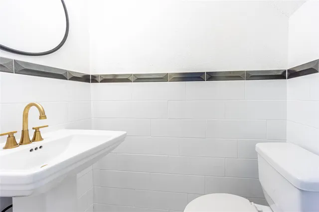 an empty room with a window and a ceiling fan