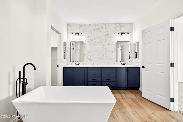 a bathroom with a tub and shower