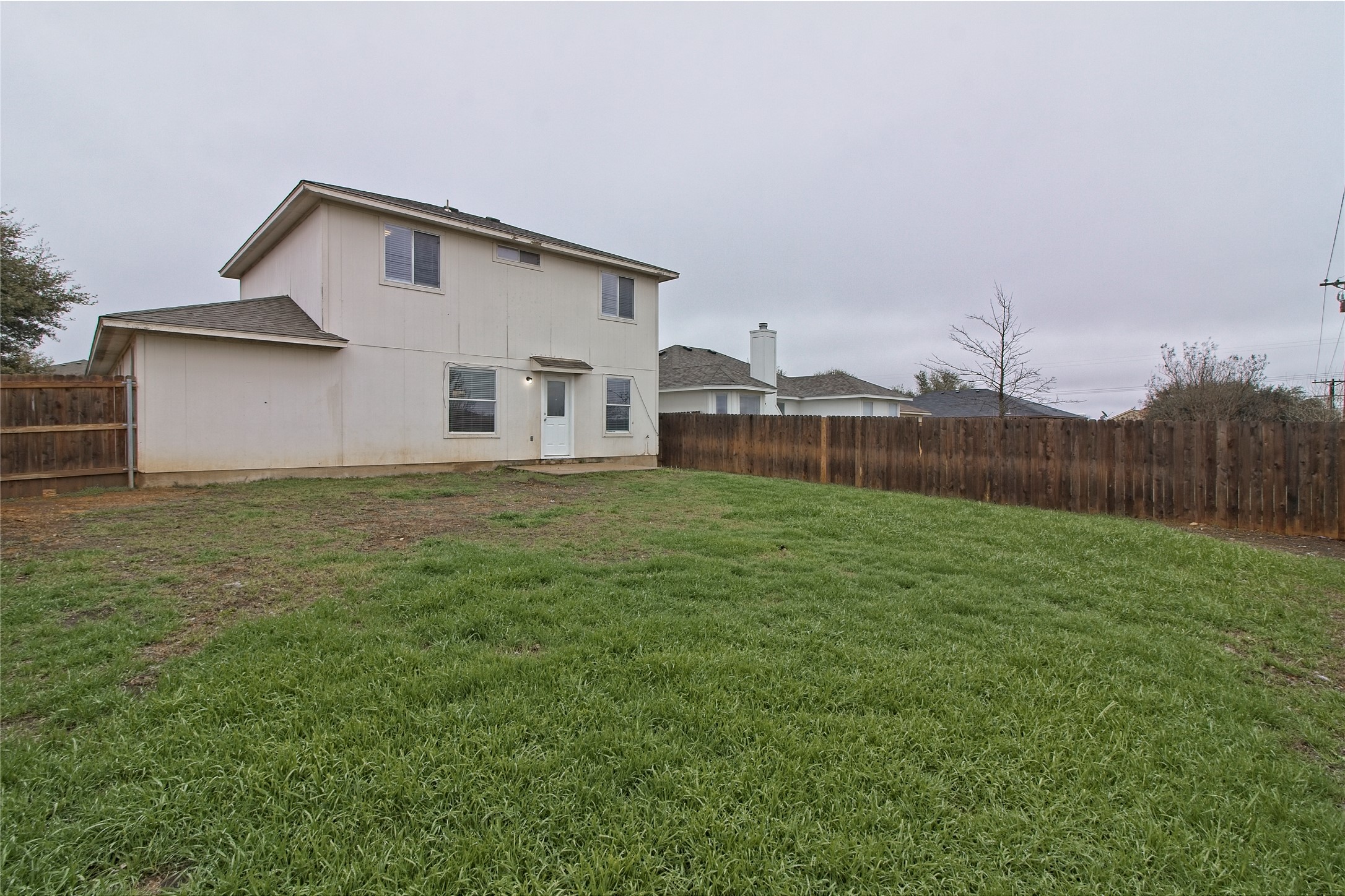 232 Brickyard Lane Jarrell, TX 76537 - Photo 30 of 31 A private, fenced backyard awaits, offering ample space for outdoor enjoyment and relaxation.