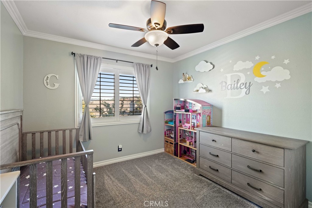 25510 Chisom Lane Stevenson Ranch, CA 91381 - Photo 25 of 53 a bedroom with a baby crib and a dresser