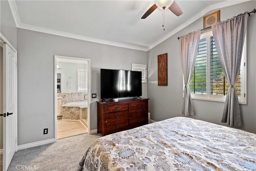 25510 Chisom Lane Stevenson Ranch, CA 91381 - Photo 28 of 53 a bedroom with a bed and a flat screen tv