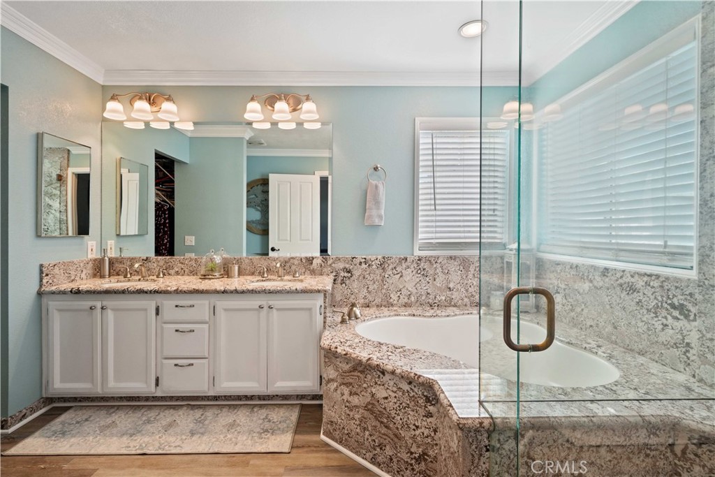 25510 Chisom Lane Stevenson Ranch, CA 91381 - Photo 30 of 53 a bathroom with a granite countertop sink and a mirror