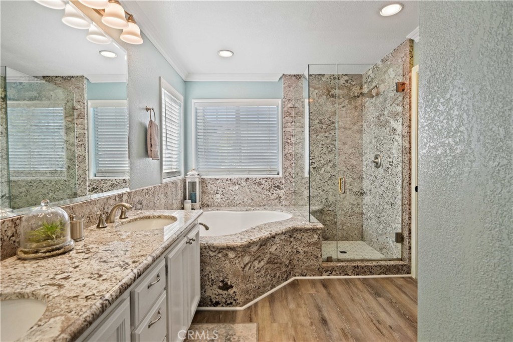 25510 Chisom Lane Stevenson Ranch, CA 91381 - Photo 31 of 53 a bathroom with a granite countertop tub sink and mirror