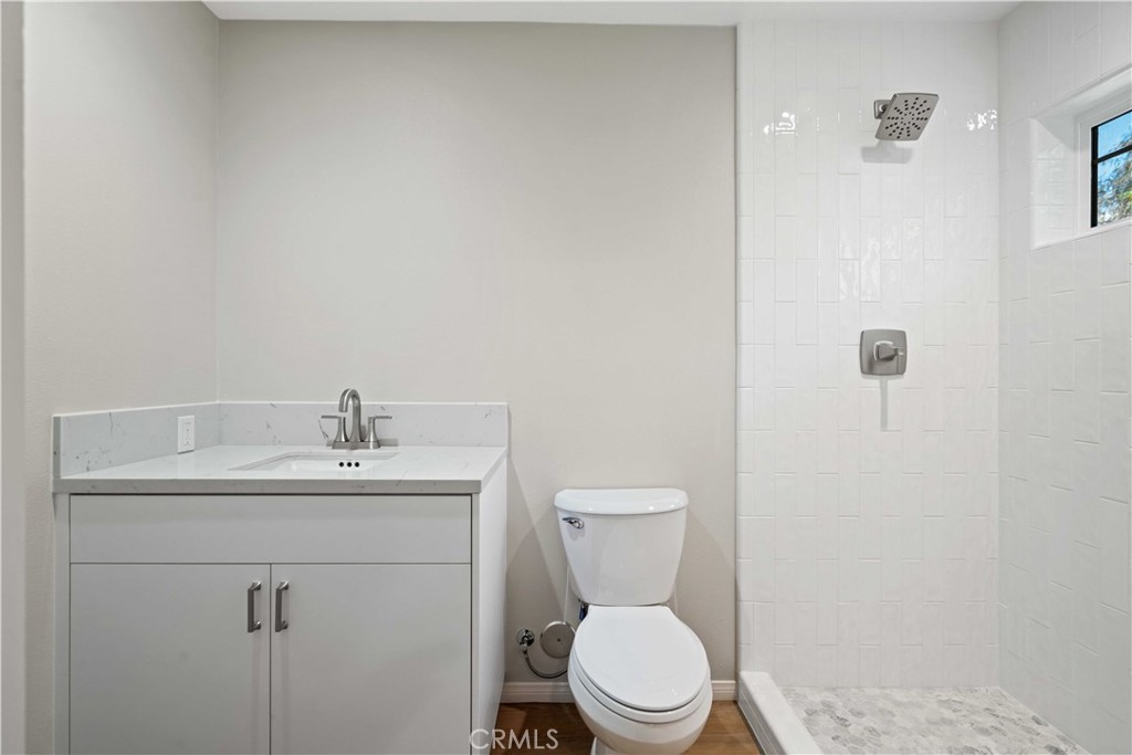 25510 Chisom Lane Stevenson Ranch, CA 91381 - Photo 39 of 53 a bathroom with a toilet a sink and mirror