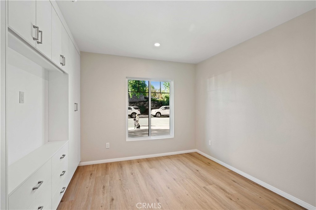 25510 Chisom Lane Stevenson Ranch, CA 91381 - Photo 41 of 53 a view of an empty room with wooden floor and a window