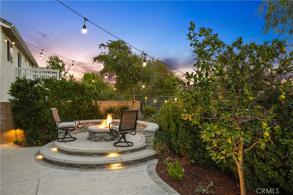 25510 Chisom Lane Stevenson Ranch, CA 91381 - Photo 42 of 53 a house view with a sitting space fire pit and outdoor space