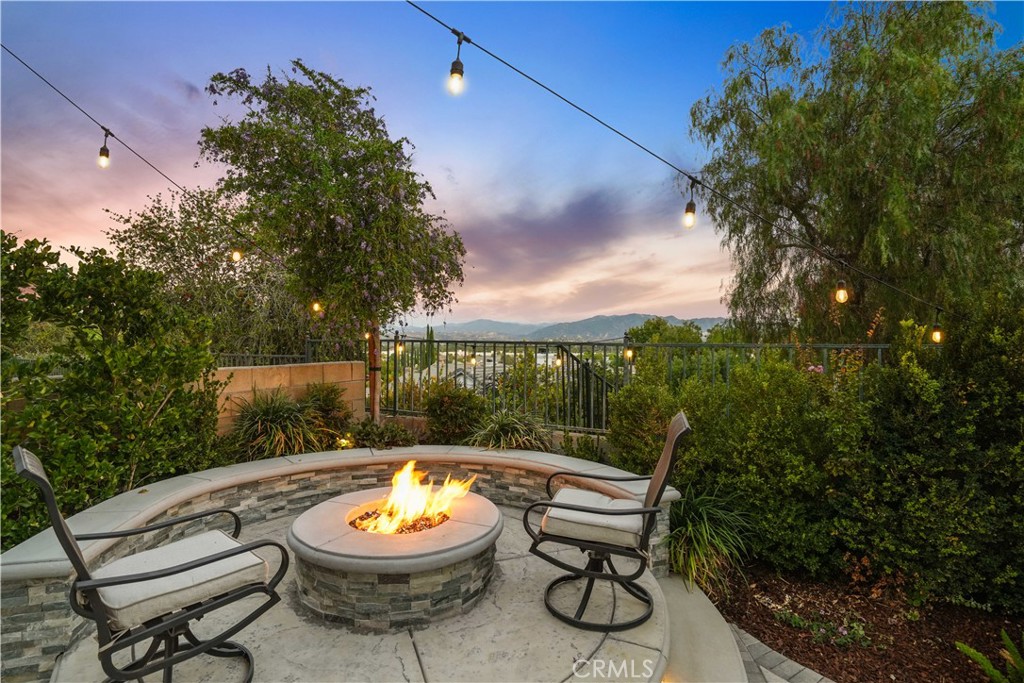 25510 Chisom Lane Stevenson Ranch, CA 91381 - Photo 46 of 53 a backyard of a house with yard fountain and outdoor seating