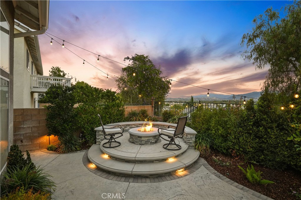 25510 Chisom Lane Stevenson Ranch, CA 91381 - Photo 49 of 53 a view of a porch with furniture and a fire pit