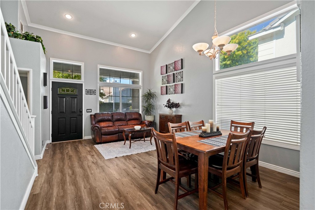 25510 Chisom Lane Stevenson Ranch, CA 91381 - Photo 8 of 53 a dining room with furniture and wooden floor