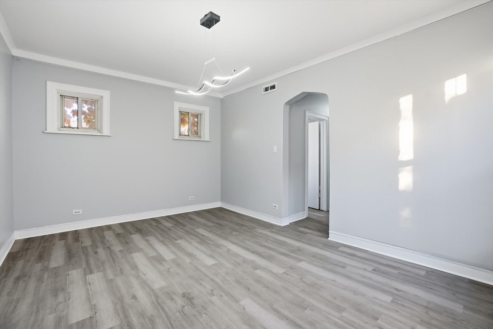 8434 South Drexel Avenue Chicago, IL 60619 - Photo 13 of 19 a view of empty room with wooden floor