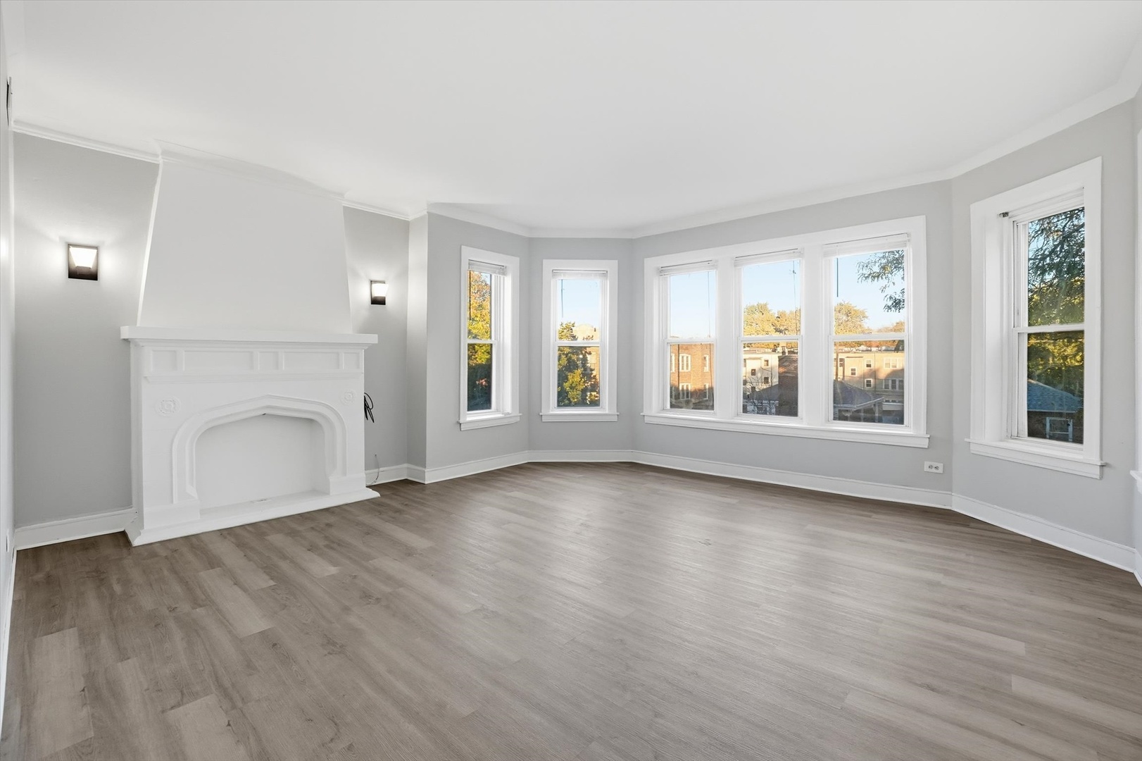 8434 South Drexel Avenue Chicago, IL 60619 - Photo 3 of 19 an empty room with wooden floor and windows