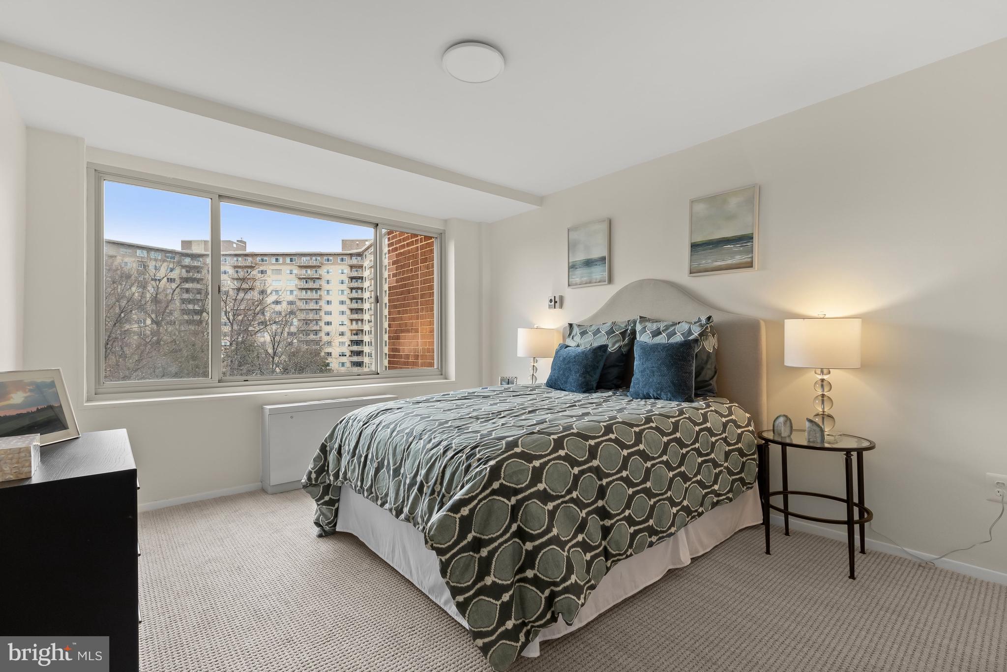 4000 Tunlaw Road Northwest, Unit 1007 Washington, DC 20007 - Photo 23 of 50 a bedroom with a bed and a window