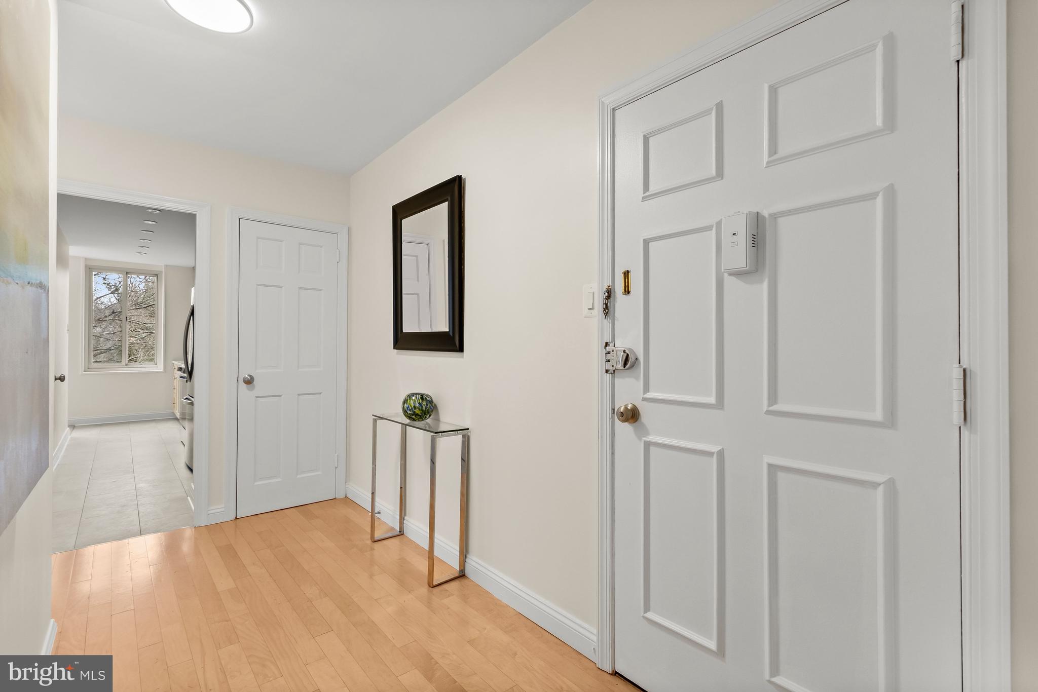 4000 Tunlaw Road Northwest, Unit 1007 Washington, DC 20007 - Photo 3 of 50 wooden floor with white walls