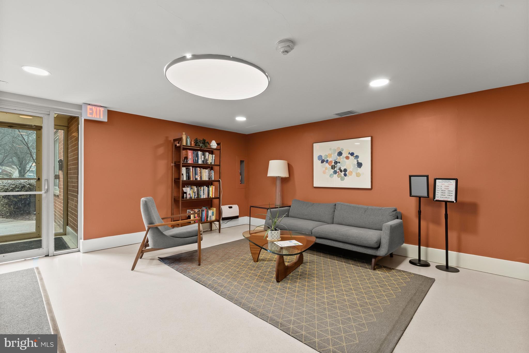 4000 Tunlaw Road Northwest, Unit 1007 Washington, DC 20007 - Photo 36 of 50 a living room with furniture a rug and a large window