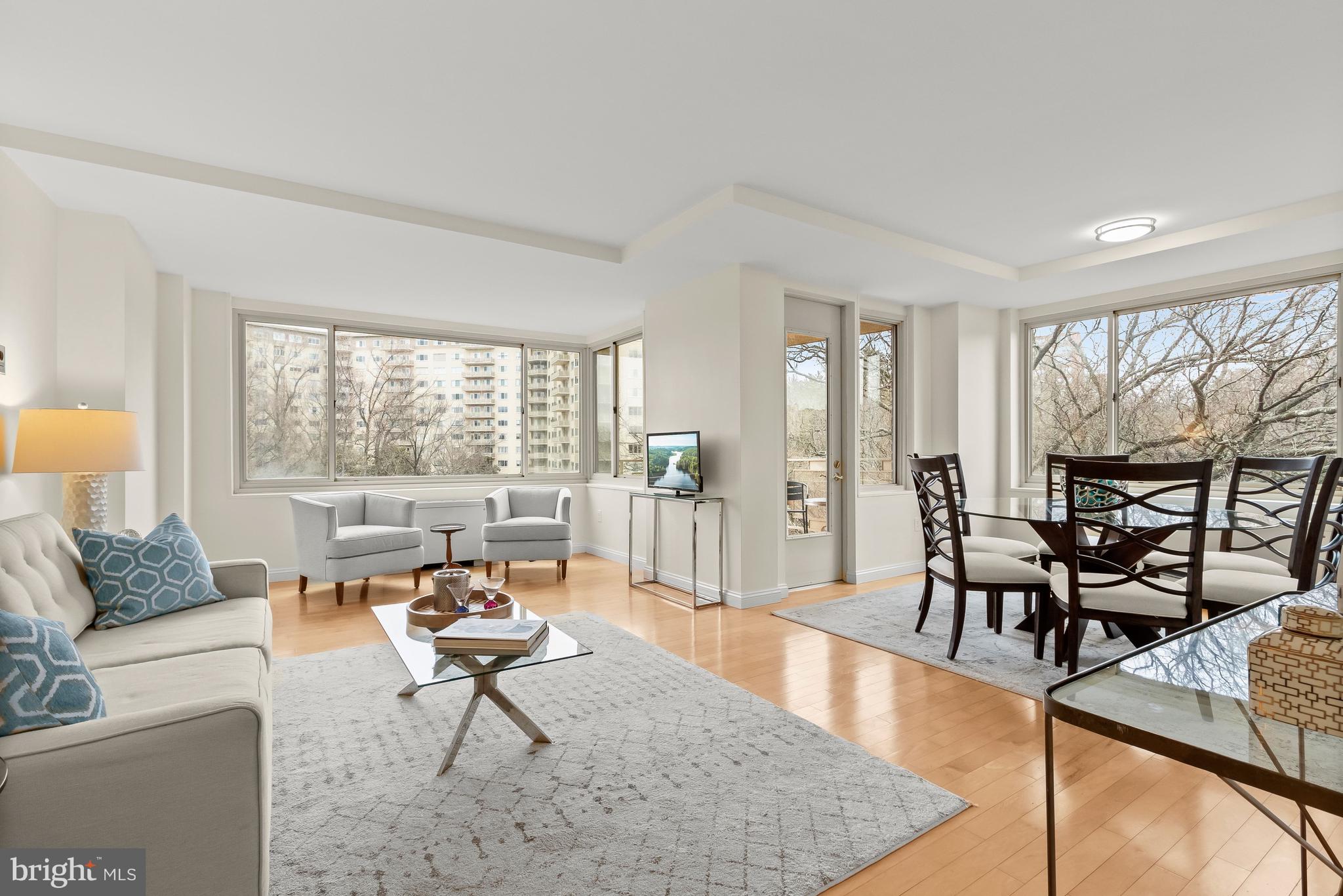 4000 Tunlaw Road Northwest, Unit 1007 Washington, DC 20007 - Photo 49 of 50 a living room with furniture and a large window