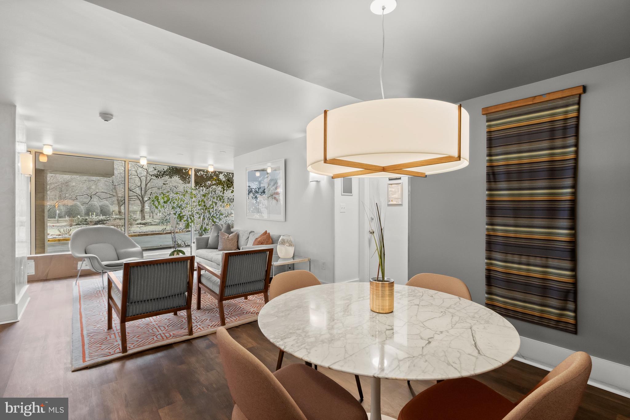 4000 Tunlaw Road Northwest, Unit 1007 Washington, DC 20007 - Photo 40 of 50 a dining room with furniture and wooden floor