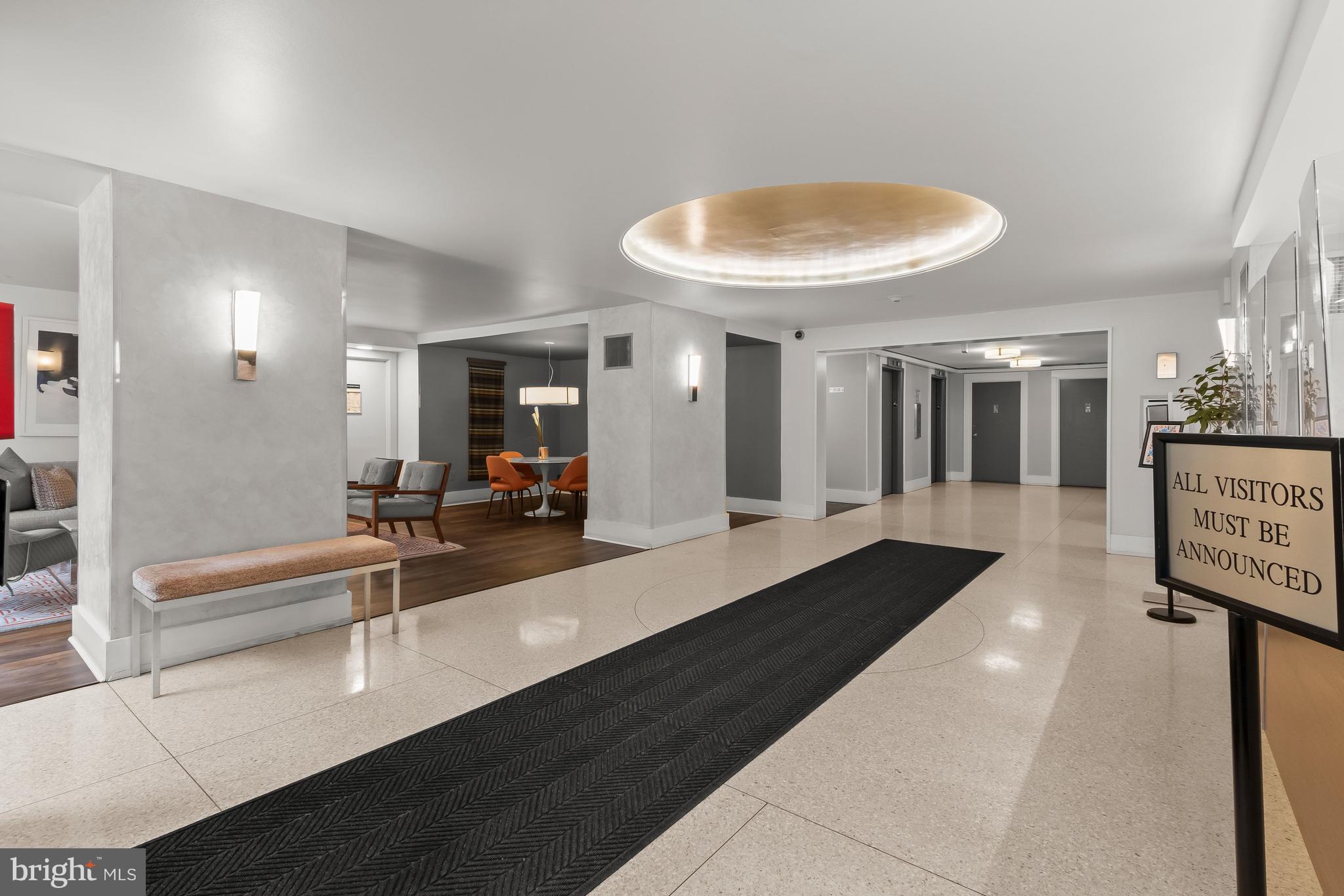 4000 Tunlaw Road Northwest, Unit 1007 Washington, DC 20007 - Photo 43 of 50 a lobby with furniture and a large window