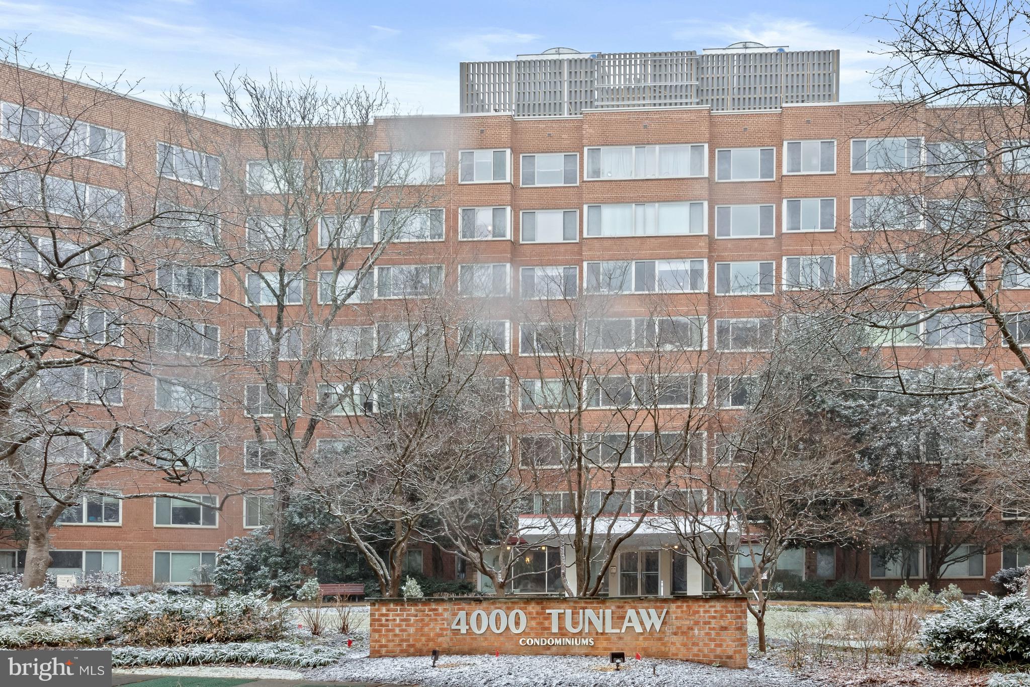 4000 Tunlaw Road Northwest, Unit 1007 Washington, DC 20007 - Photo 48 of 50 a view of a brick building next to a yard