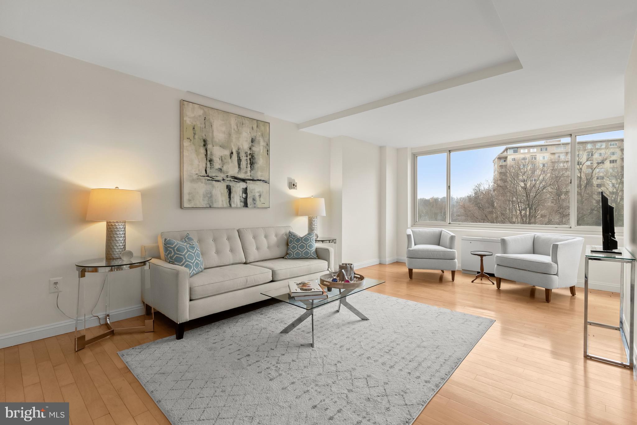 4000 Tunlaw Road Northwest, Unit 1007 Washington, DC 20007 - Photo 6 of 50 a living room with furniture and a large window