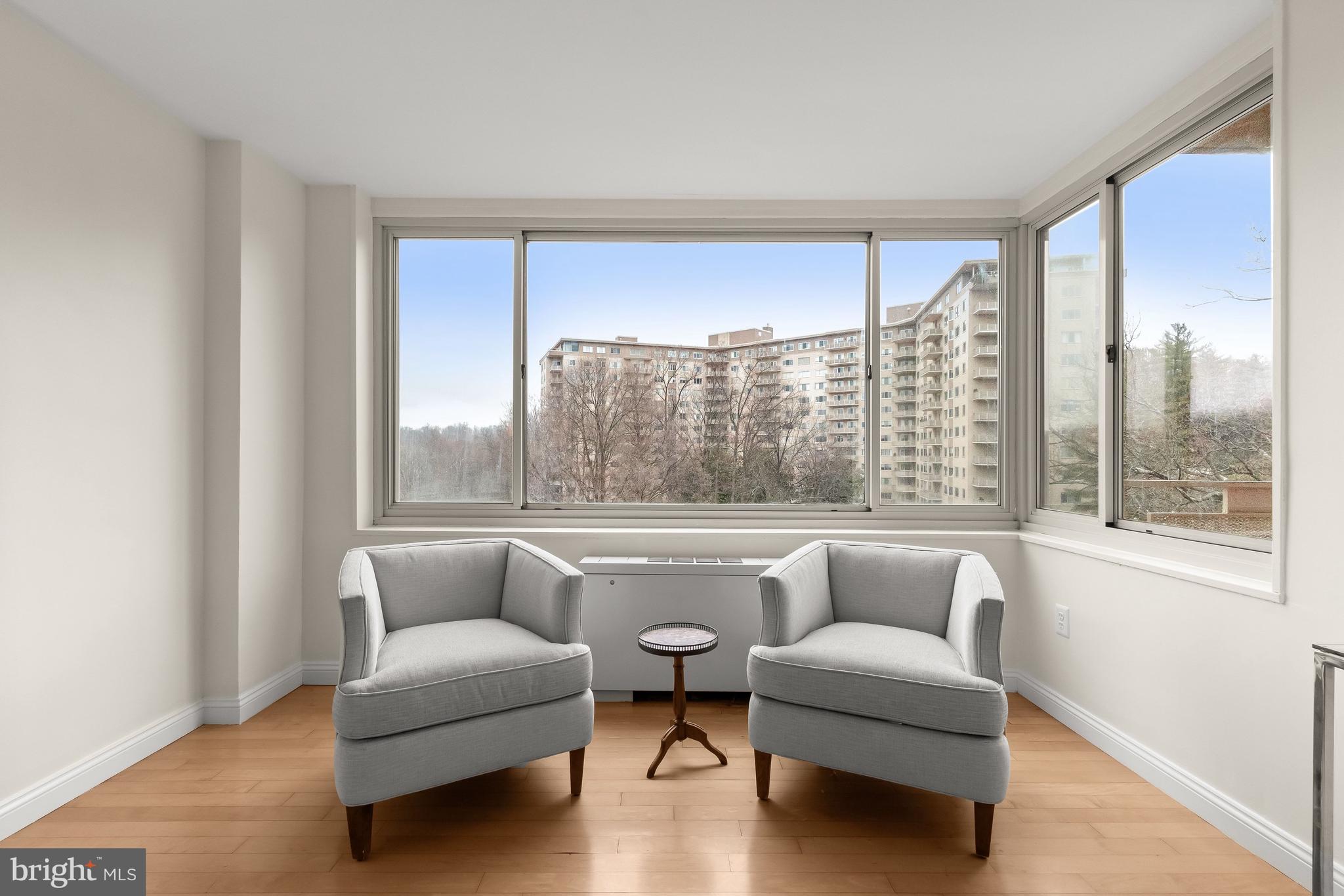4000 Tunlaw Road Northwest, Unit 1007 Washington, DC 20007 - Photo 7 of 50 a living room with furniture and a large window