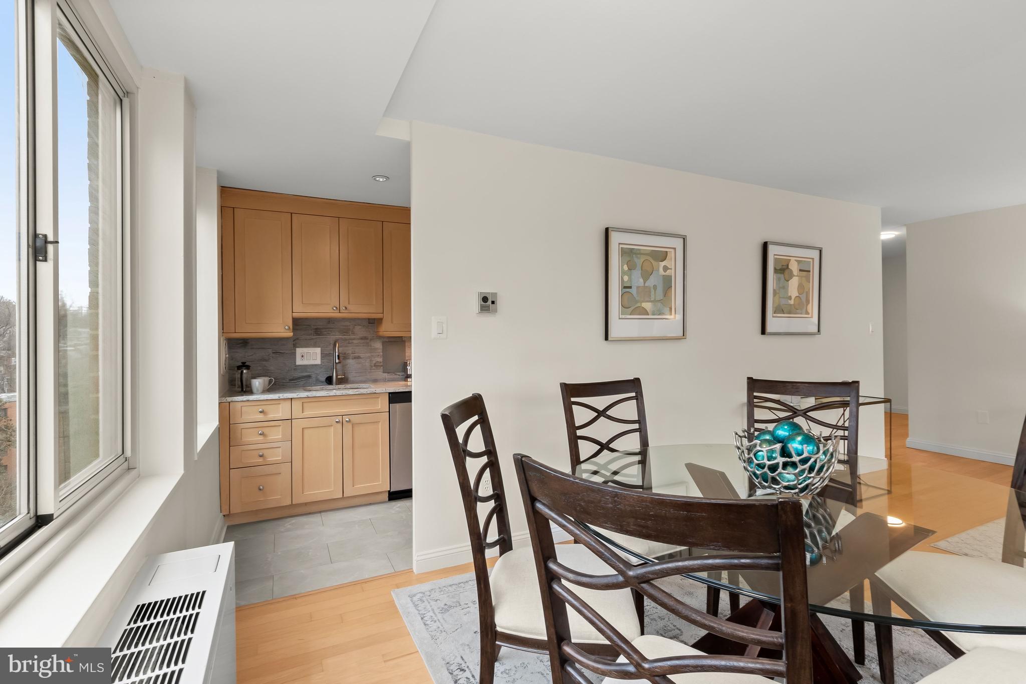 4000 Tunlaw Road Northwest, Unit 1007 Washington, DC 20007 - Photo 9 of 50 a dining room with furniture and window