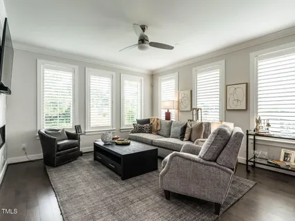 a view of a white house with a street