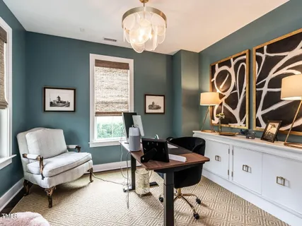 a kitchen with center island a sink appliances and a dining table
