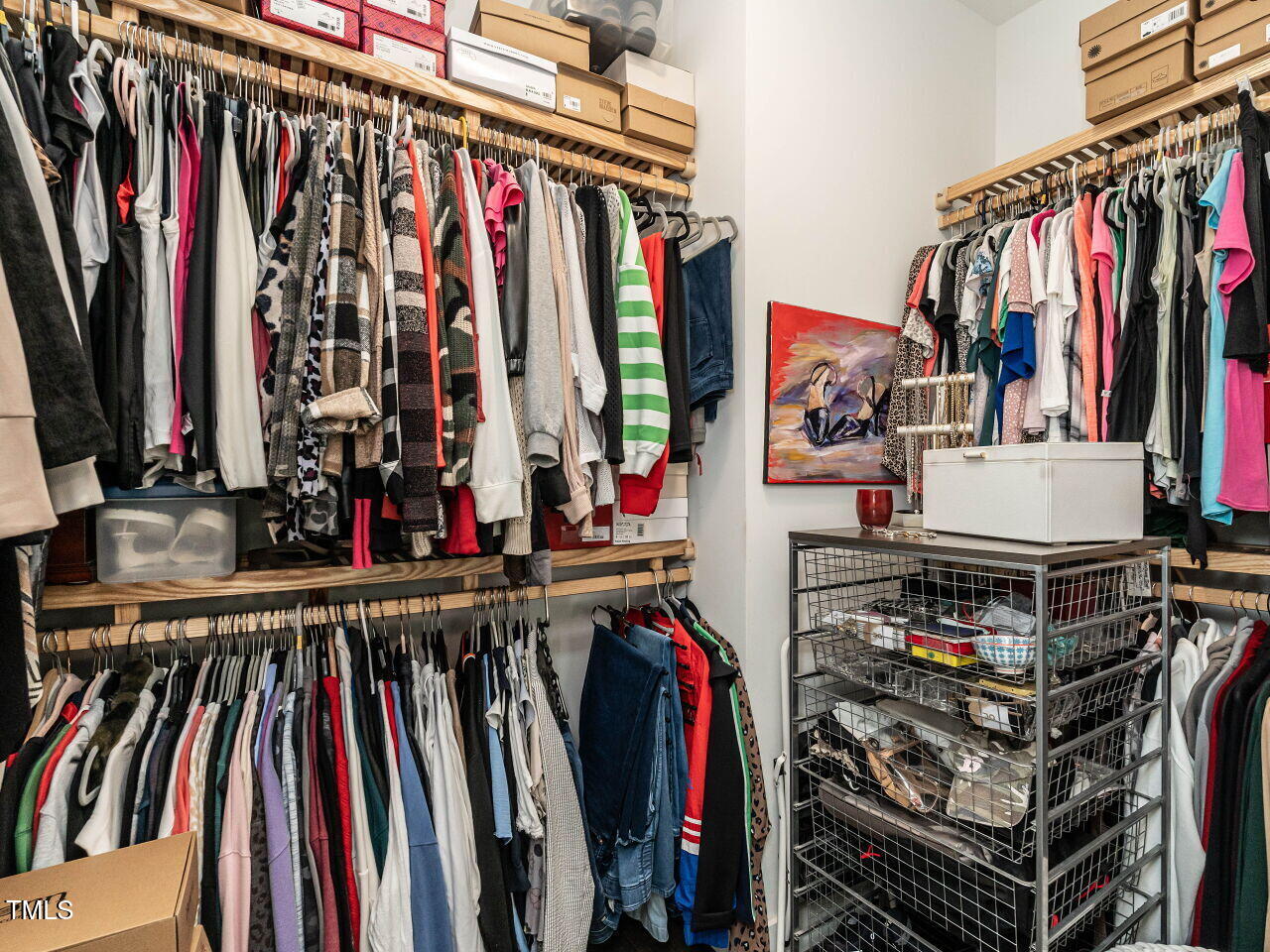 1610 Draper View Loop, Unit 101 Raleigh, NC 27608 - Photo 24 of 39 a view of walk in closet with clothes and shoes