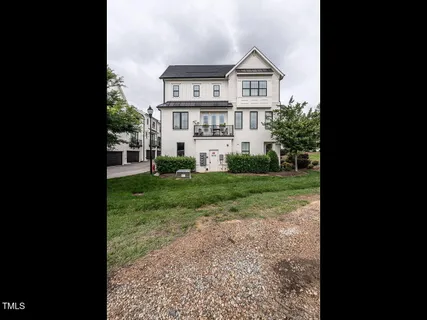 a bathroom with a sink a toilet and shower curtain
