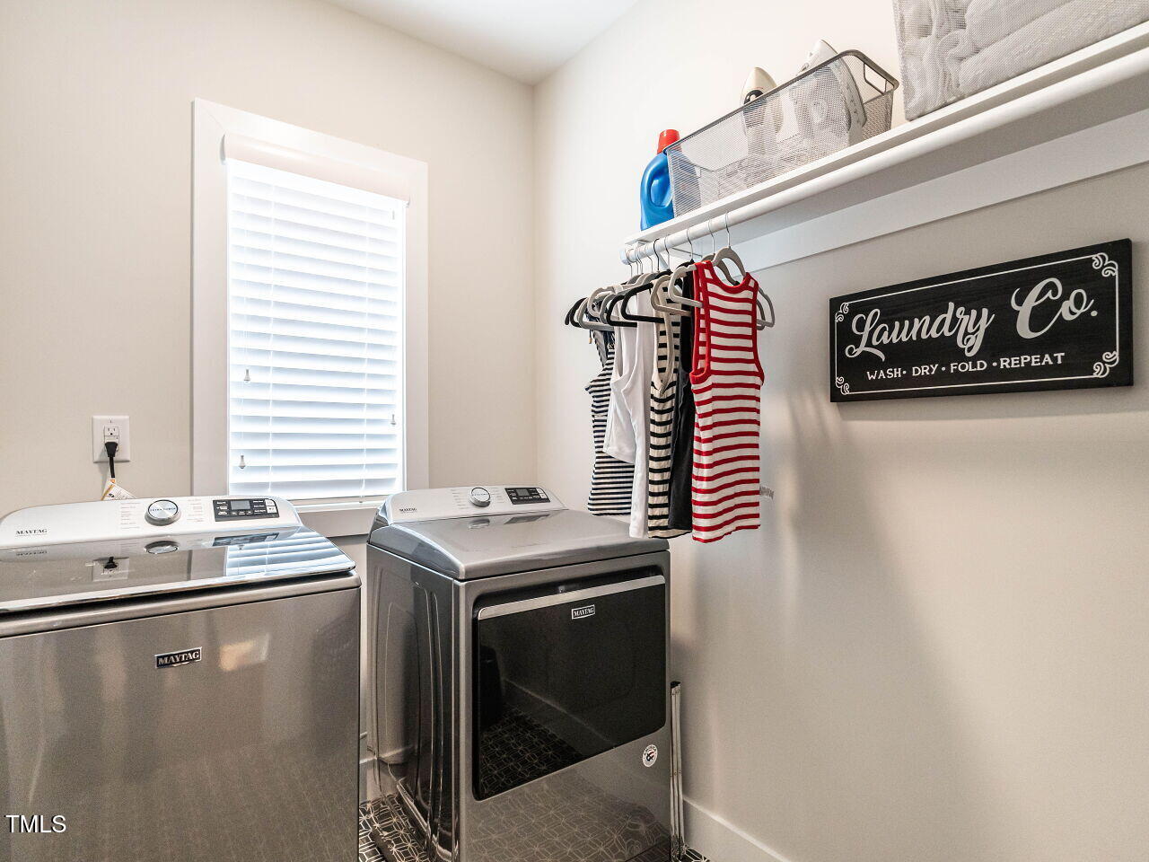 1610 Draper View Loop, Unit 101 Raleigh, NC 27608 - Photo 29 of 39 a utility room with stainless steel appliances a sink and a window