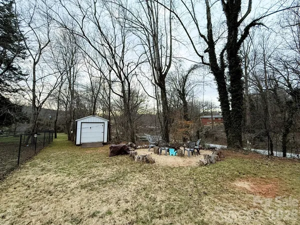 a backyard of a house with trees
