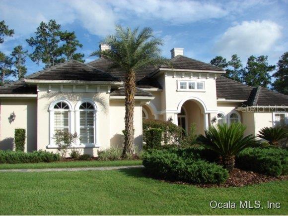3075 Northwest 79th Ave Road Ocala, FL 34482 - Photo 1 of 1 a front view of a house with a garden
