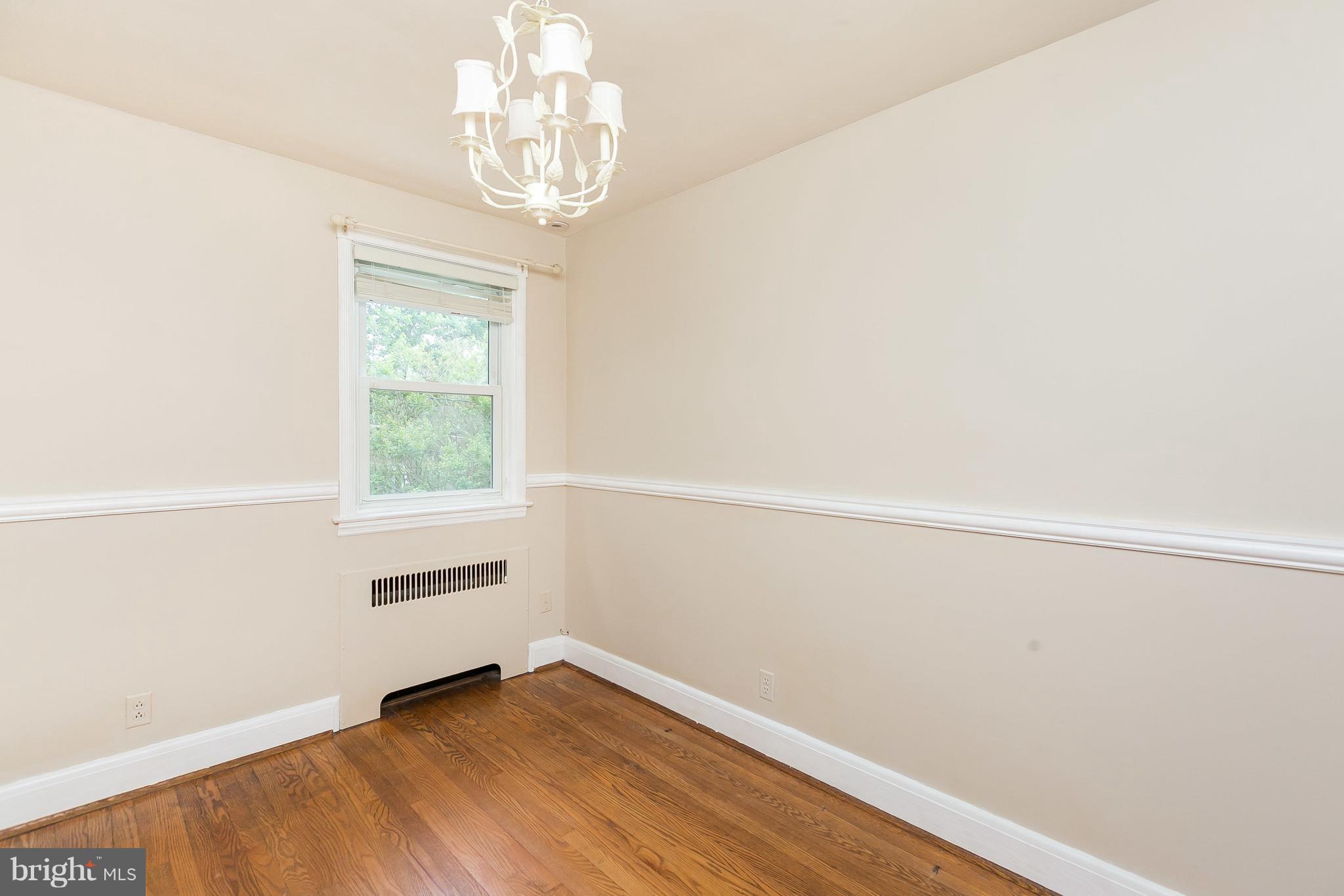 39 Murdock Road Baltimore, MD 21212 - Photo 14 of 28 a view of a room with wooden floor and windows