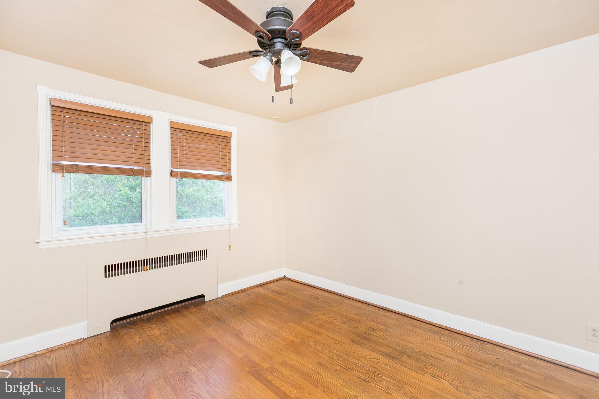 39 Murdock Road Baltimore, MD 21212 - Photo 16 of 28 an empty room with a window and a fan