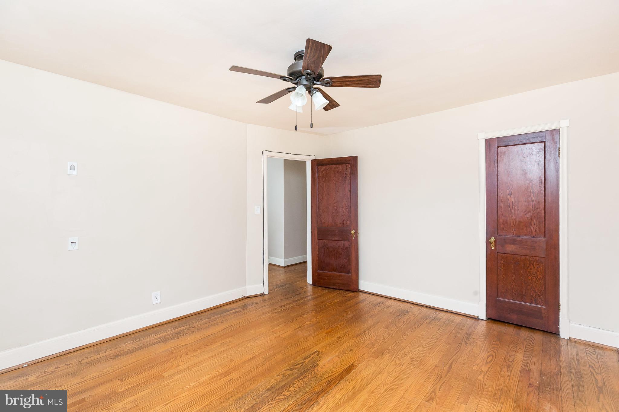 39 Murdock Road Baltimore, MD 21212 - Photo 20 of 28 a view of empty room with wooden floor