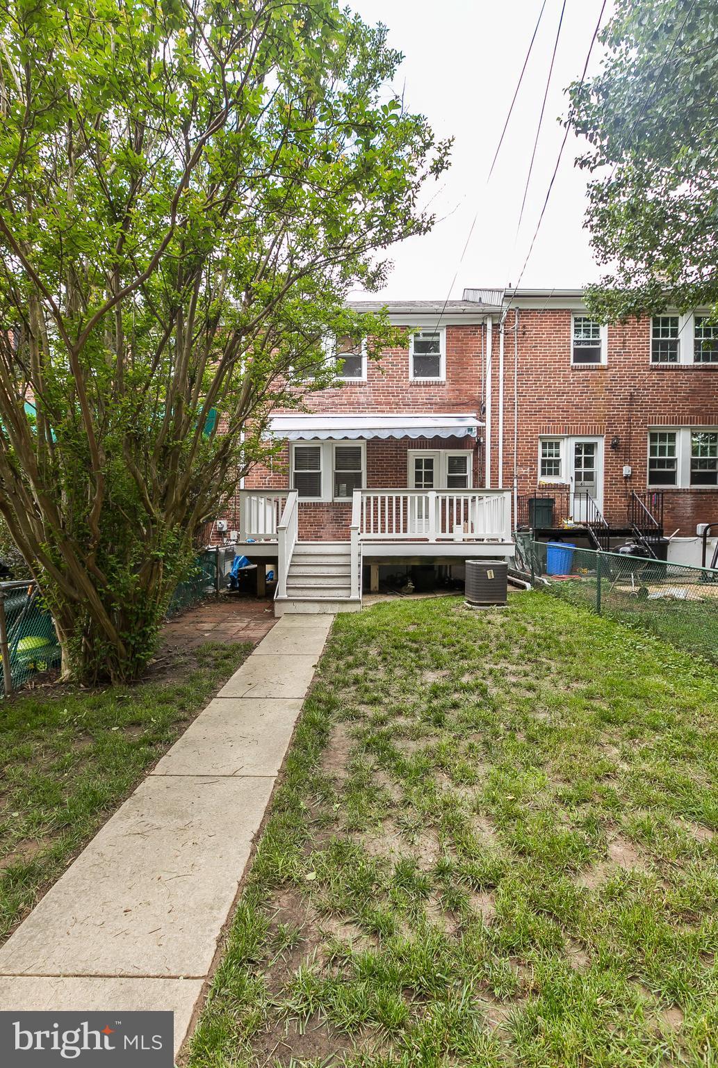 39 Murdock Road Baltimore, MD 21212 - Photo 28 of 28 a front view of a house with a yard table and chairs