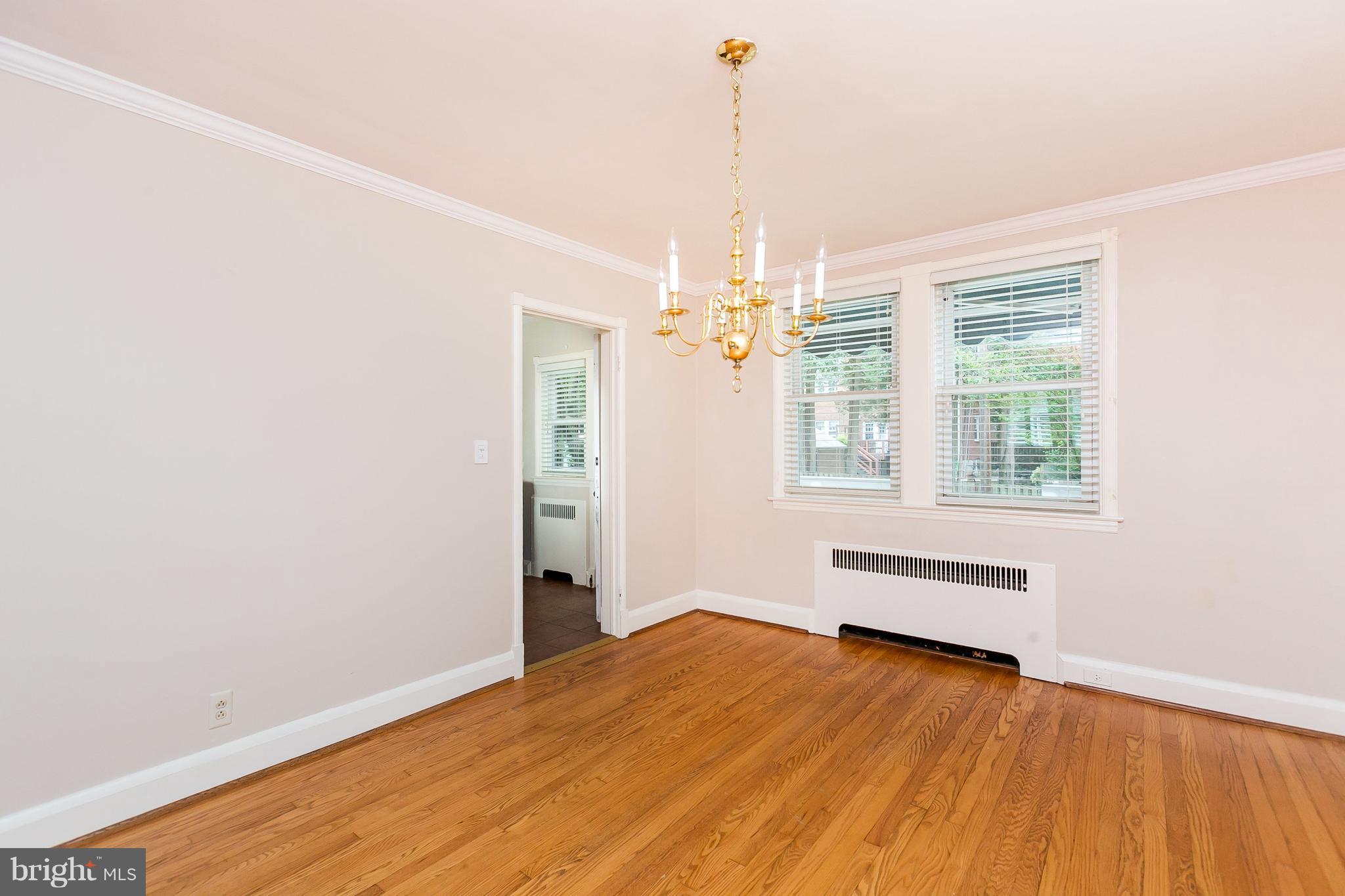 39 Murdock Road Baltimore, MD 21212 - Photo 9 of 28 a view of empty room with wooden floor and fan