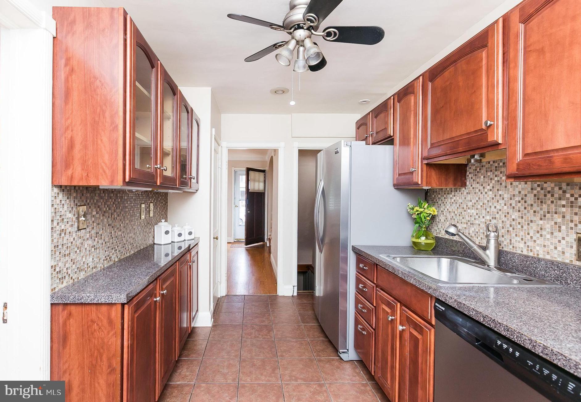 39 Murdock Road Baltimore, MD 21212 - Photo 10 of 28 a kitchen with stainless steel appliances granite countertop a sink stove and refrigerator