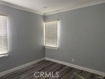 2293 Grand Long Beach, CA 90815 - Photo 5 of 7 a view of an empty room with wooden floor and a window