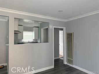 2293 Grand Long Beach, CA 90815 - Photo 7 of 7 a view of a hallway with wooden floor and a bathroom