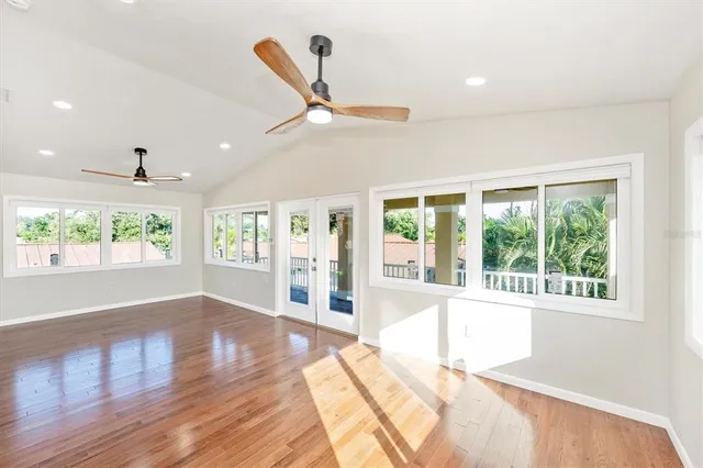 a view of an entryway with wooden floor