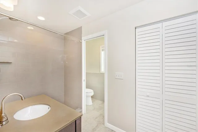 a bathroom with a sink double vanity and a mirror