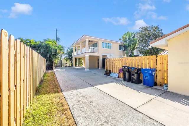 a view of a house with a backyard