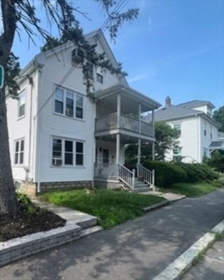59 14th Avenue, Unit 2 Haverhill, MA 01830 - Photo 1 of 11 a front view of a house with garden and porch